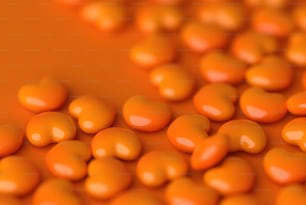 a close up of a bunch of orange candies