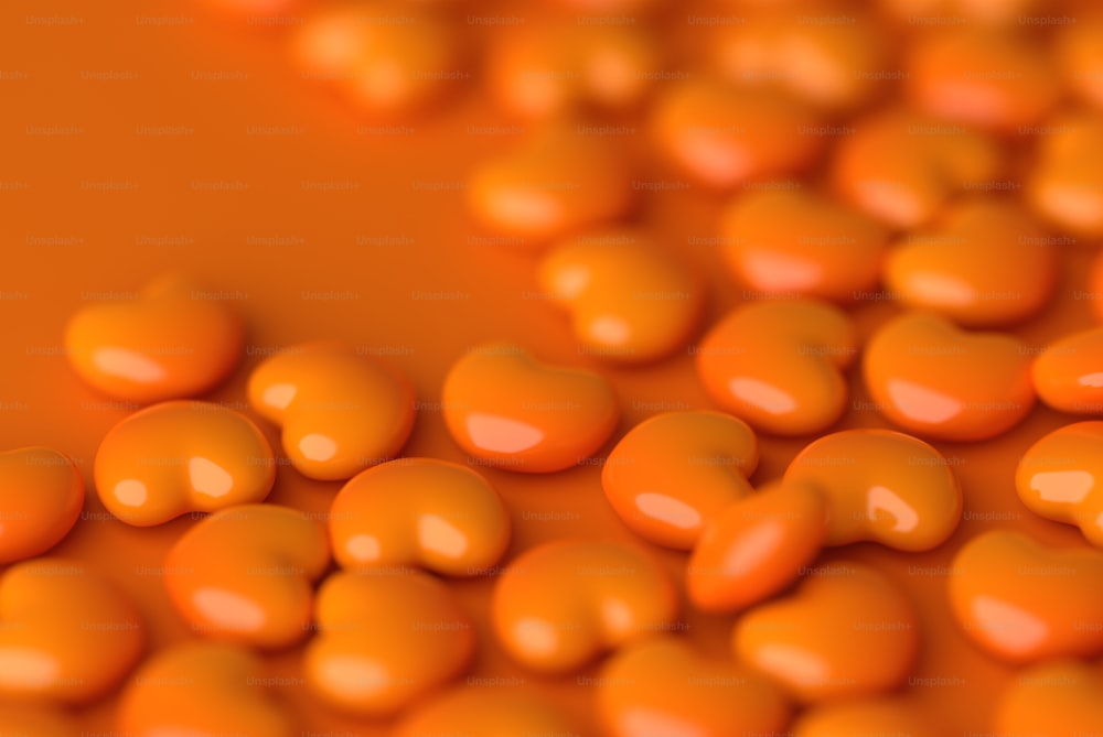 a close up of a bunch of orange candies