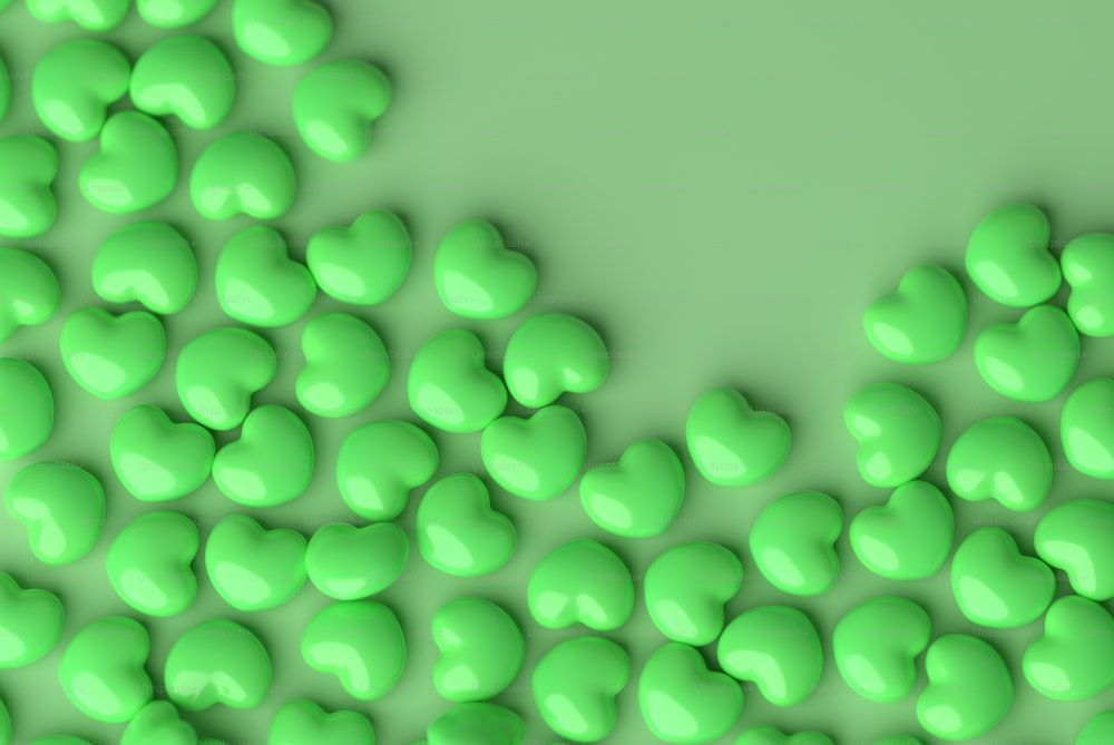 Un grupo de corazones verdes sobre fondo verde