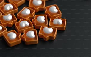 a group of orange and white objects on a black surface