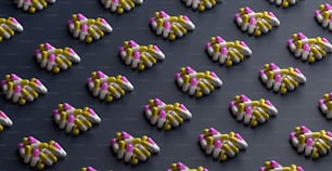 a large group of small white and pink objects