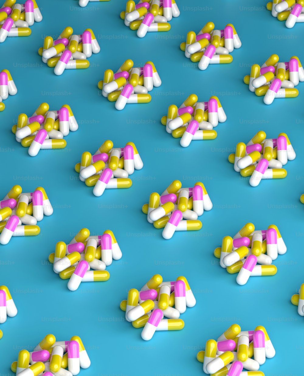 a lot of pills that are on a blue surface