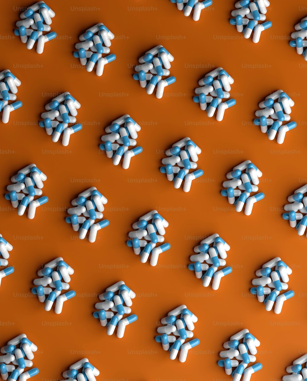 a group of blue and white candies on an orange background