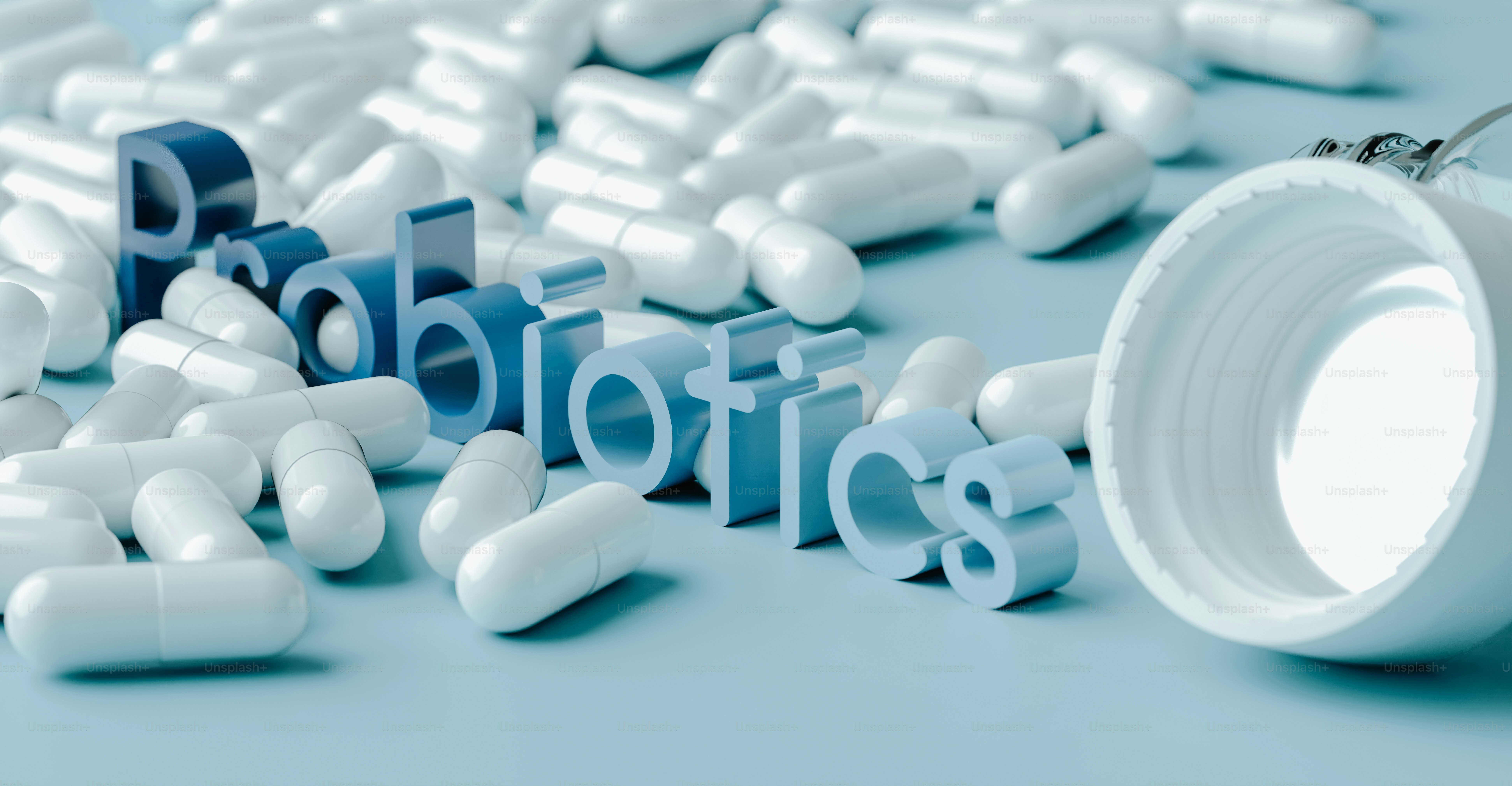 pills spilling out of a white pill bottle