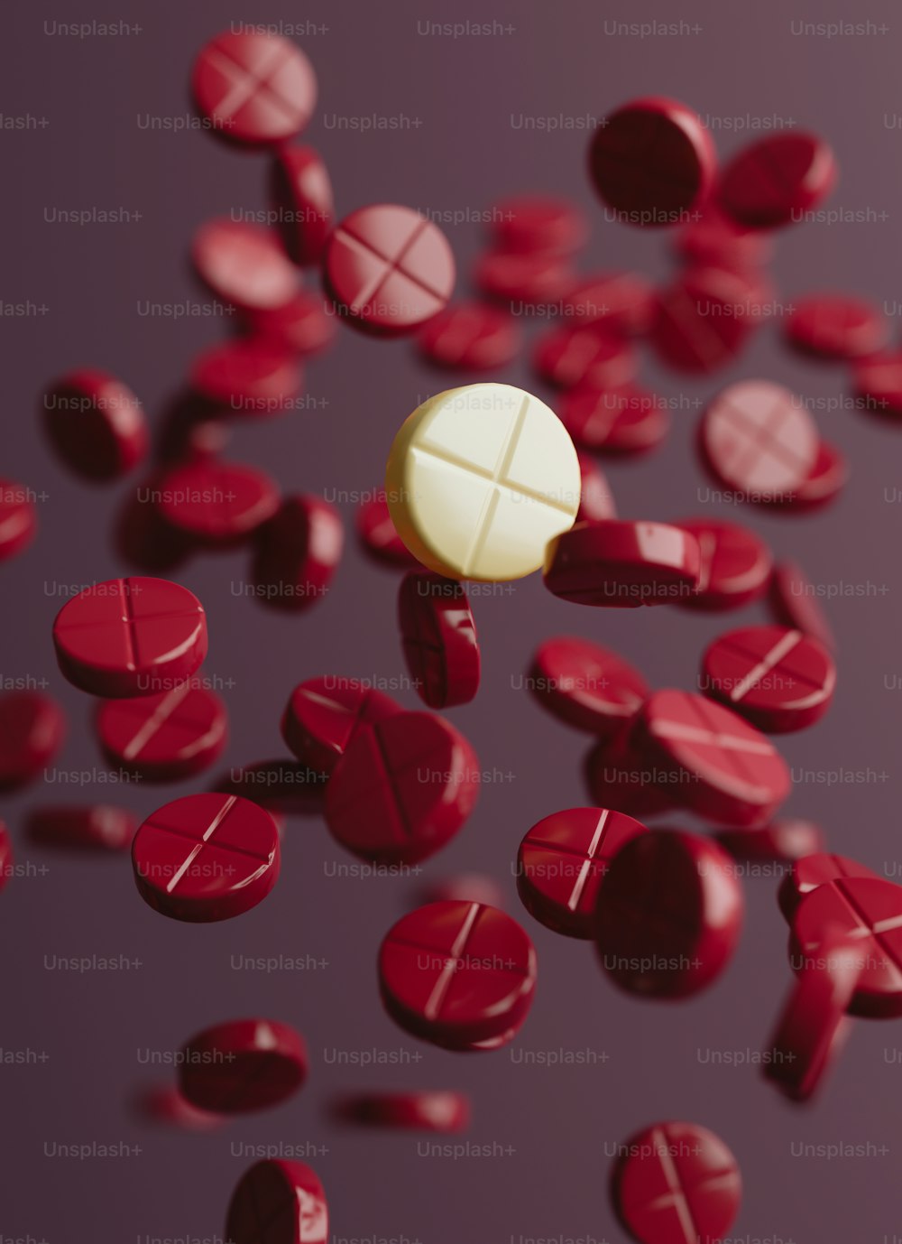 Un gruppo di pillole rosse e bianche su uno sfondo viola