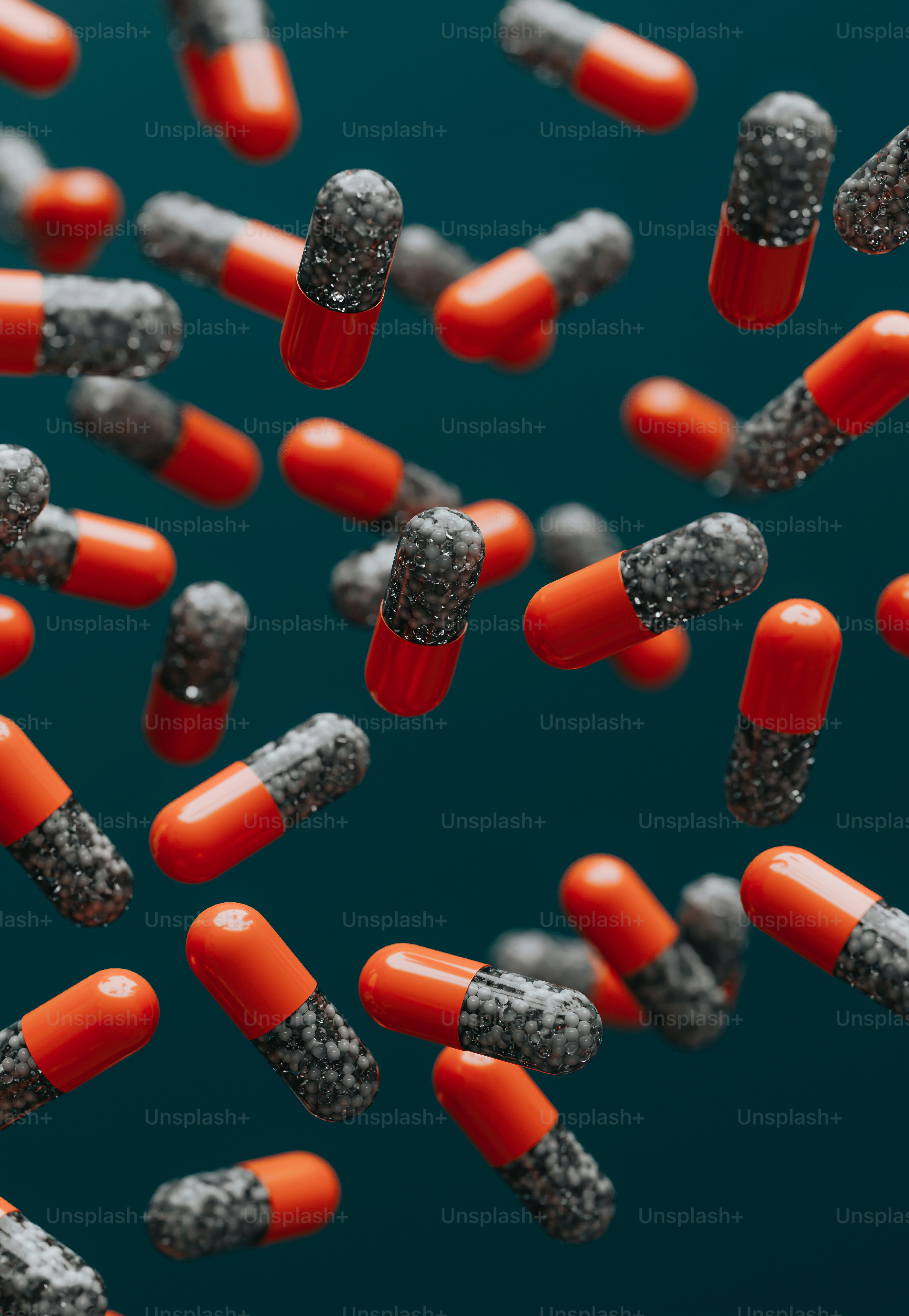 a bunch of red and black pills on a blue background