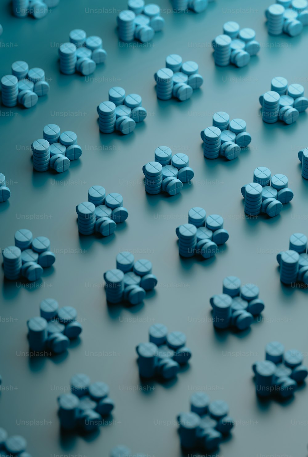 a large group of small blue objects on a table