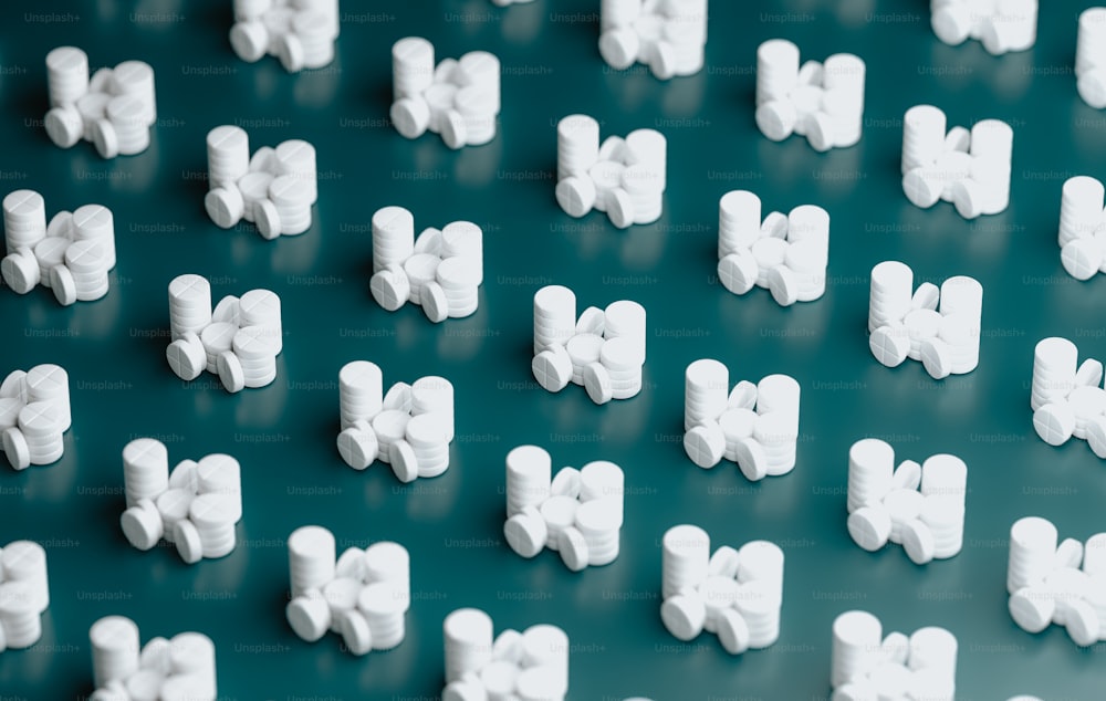a bunch of small white bows on a green surface