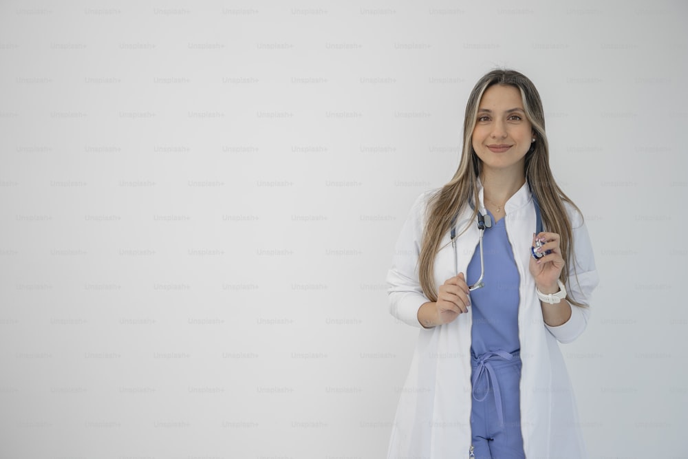 a woman in a white lab coat is holding a toothbrush