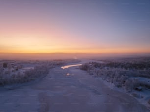 a river running through a snow covered forest