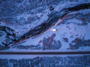an aerial view of a train track in the snow