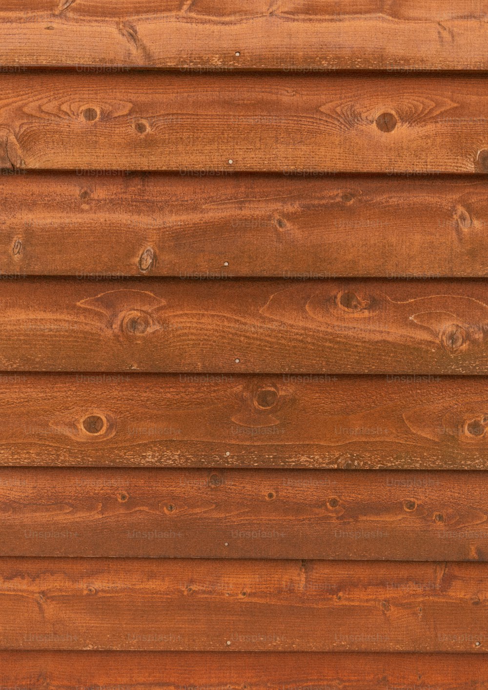 a close up of a brown wooden wall