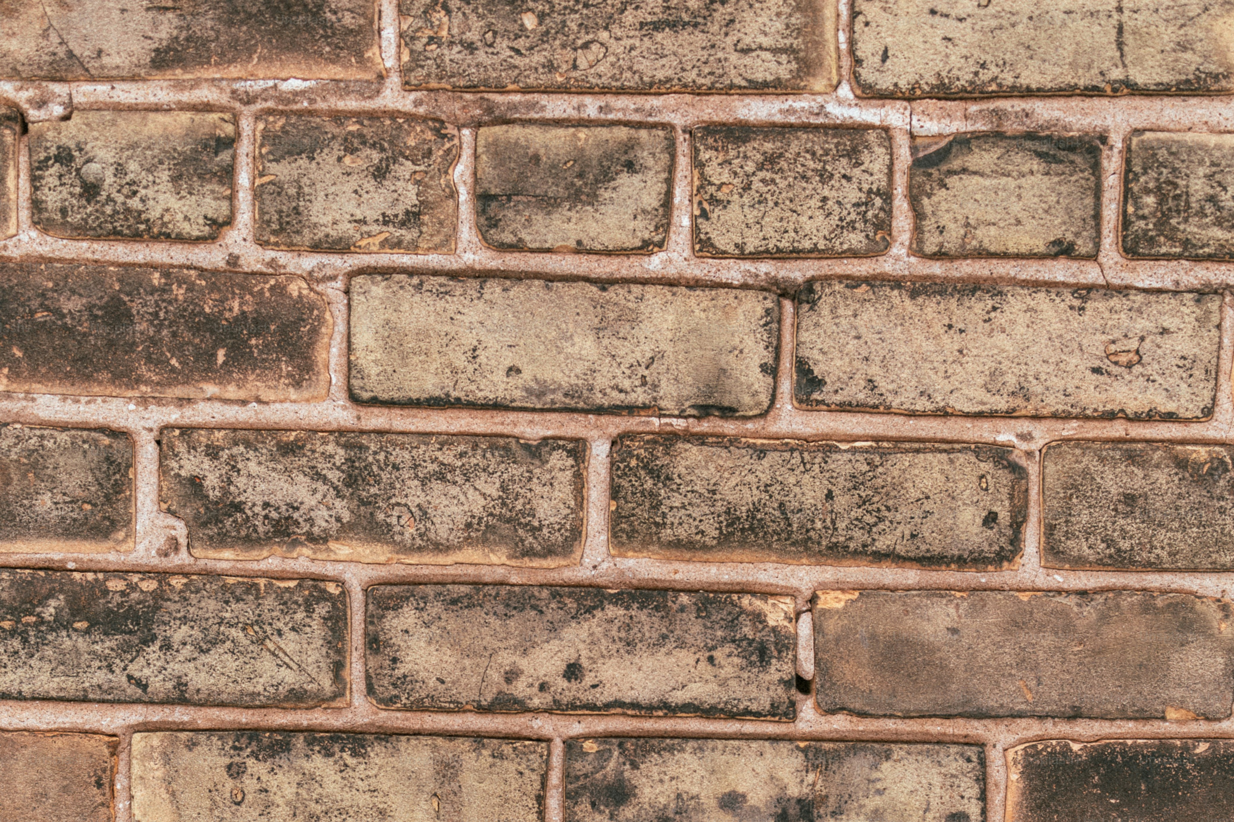 a close up of a brick wall made of bricks