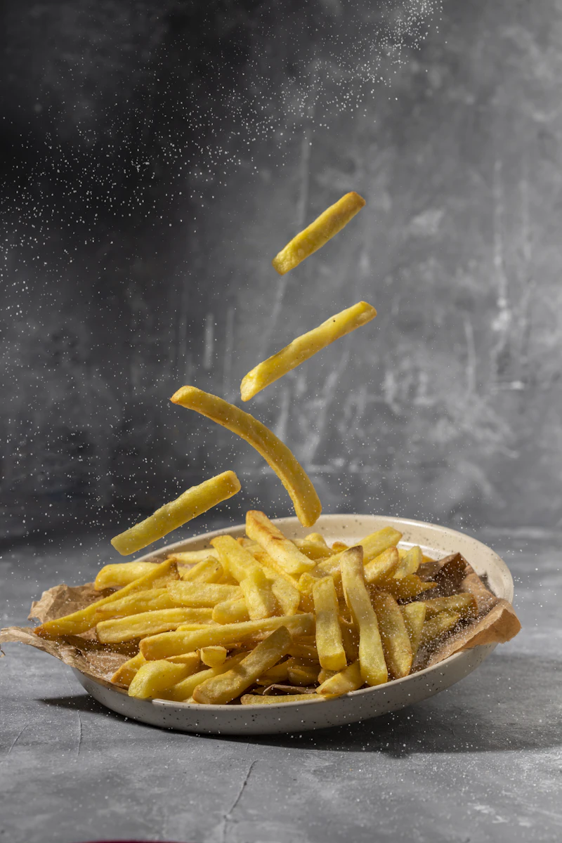 Tawa fried spiced fish steaks with fresh herbs and lemon wedges — Non-veg catering specialties