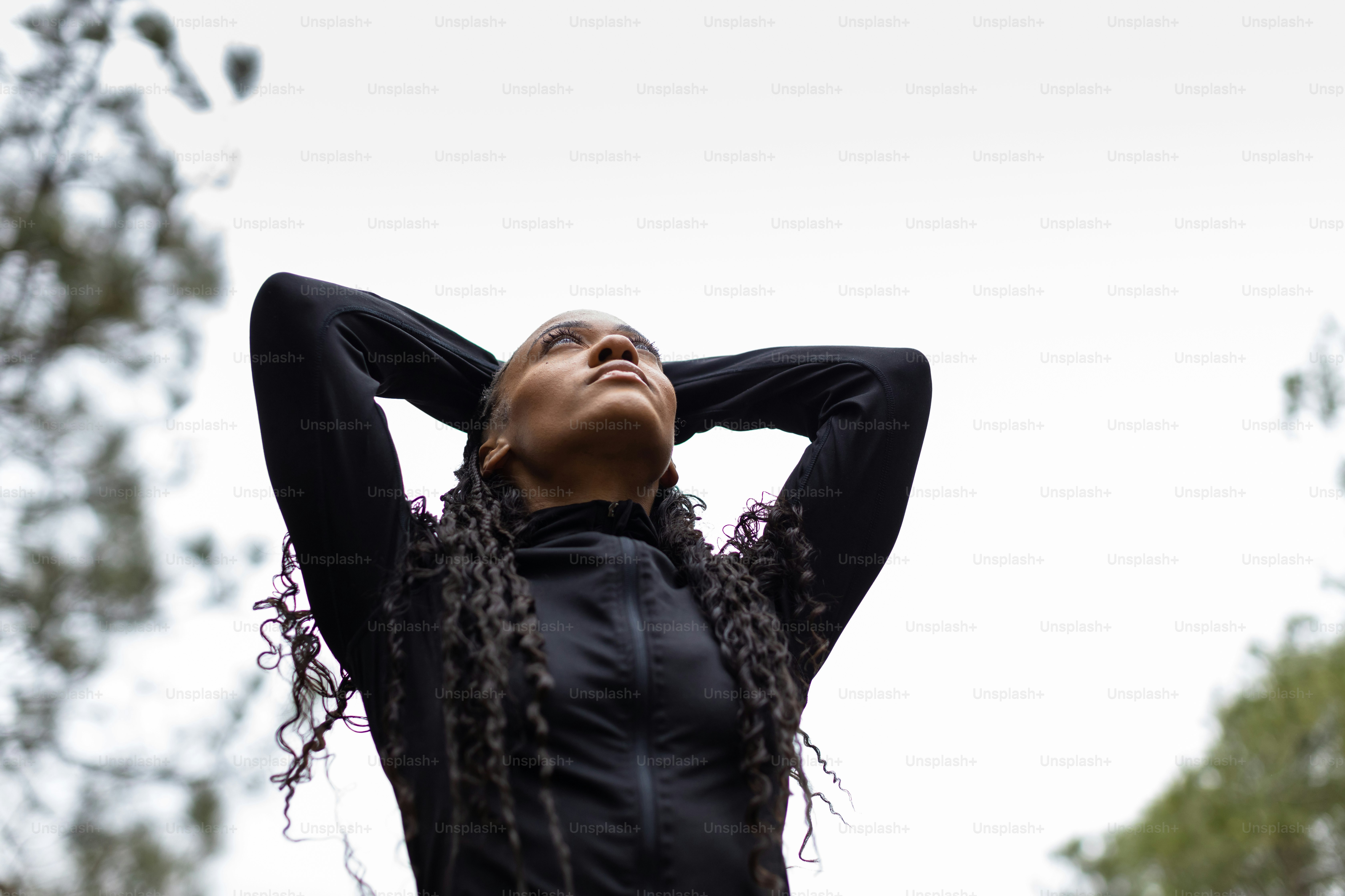 a woman with her hands on her head