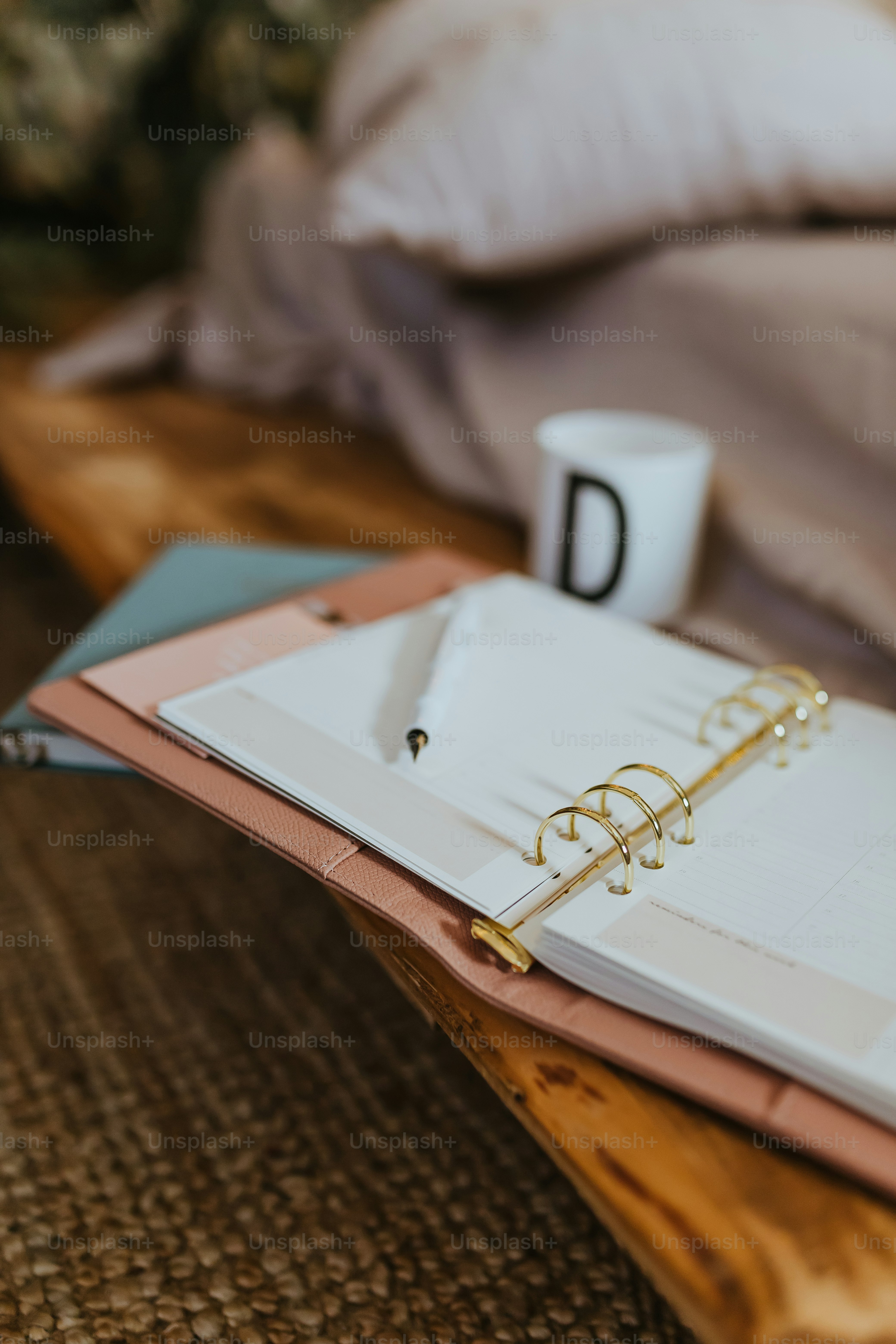 a binder with a notepad and a pen on top of it
