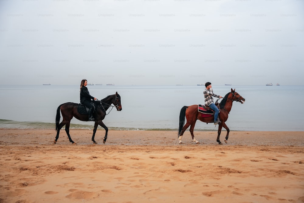 a couple of people riding on the backs of horses
