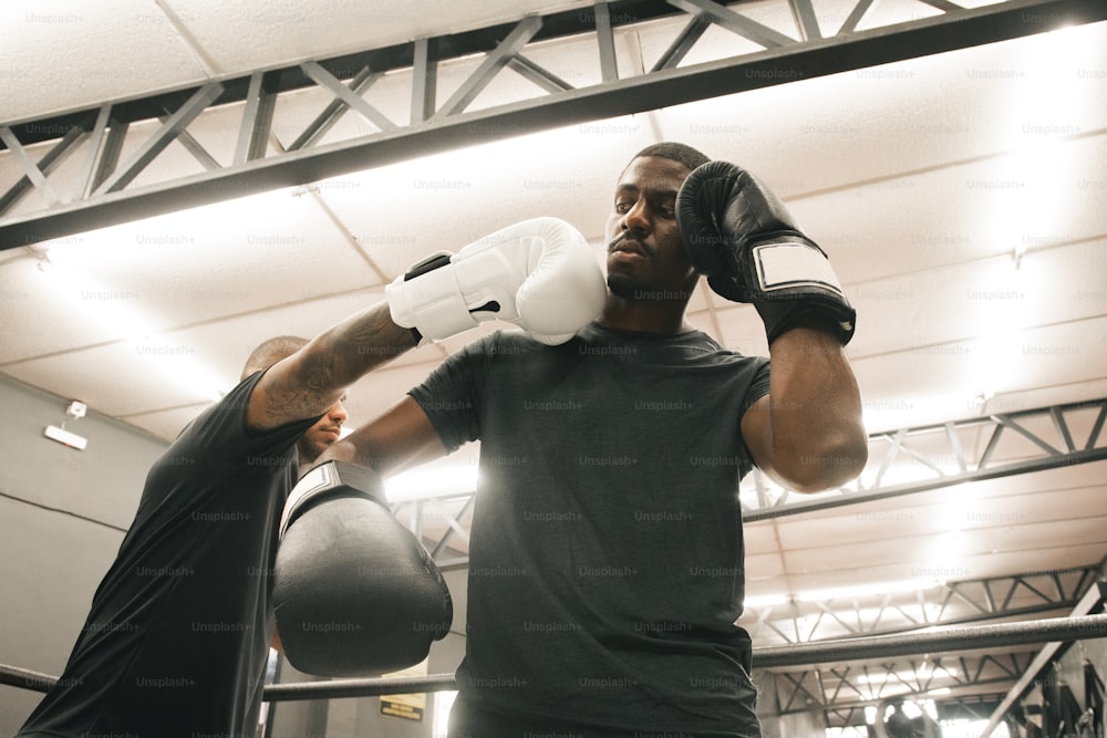 a man in a gym with a punching mitt
