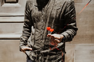 a man holding a red balloon in his hand