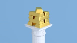 Una pila de lingotes de oro sentados encima de un pilar blanco