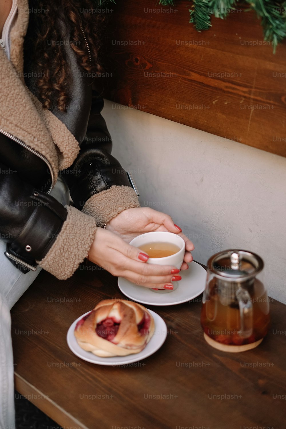 a woman sitting at a table with a plate of food