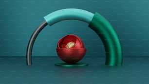 Ein roter Ball sitzt in einer grünen Schüssel