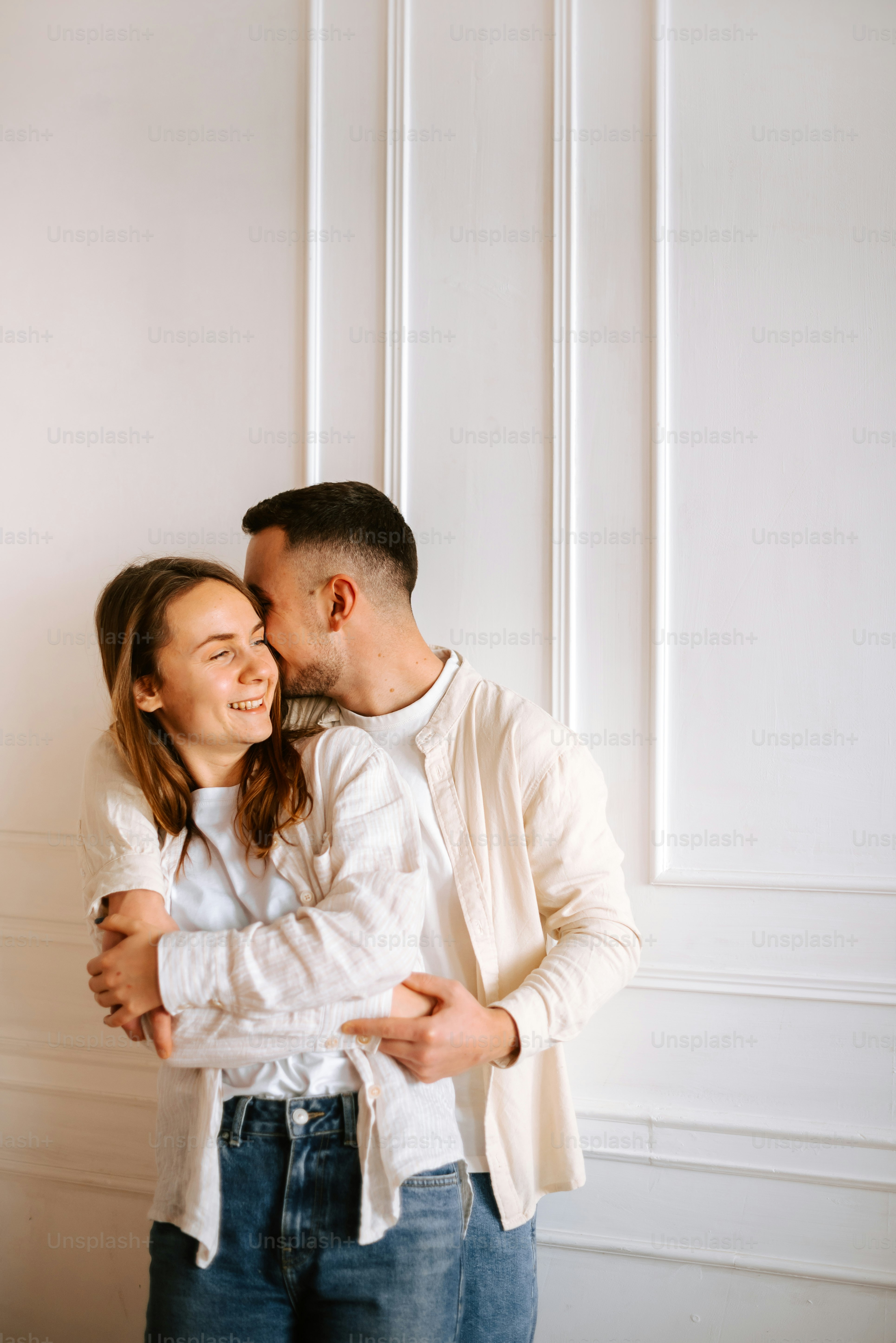 A man and a woman standing next to each other photo – People Image on ...