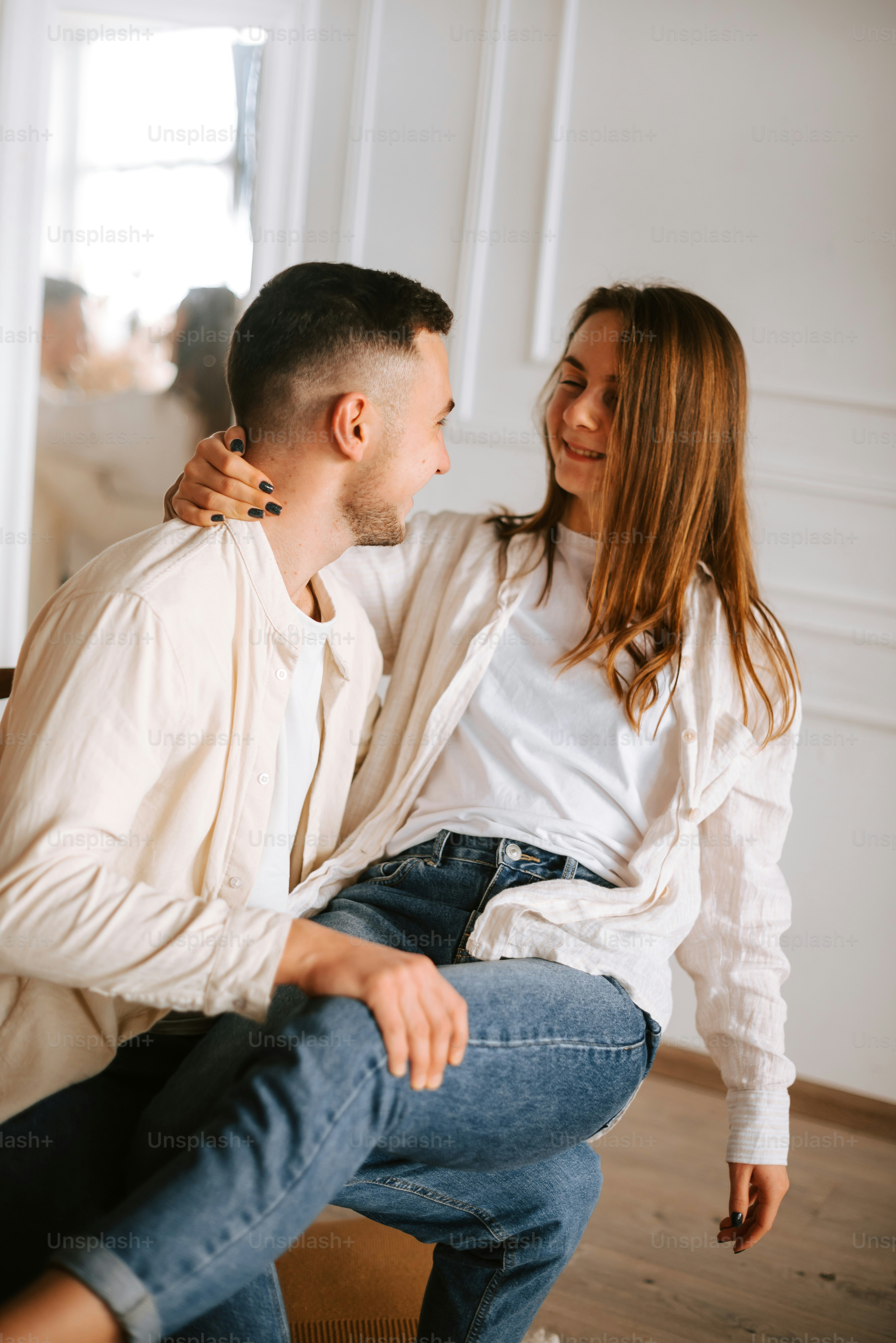 a man and a woman sitting on a bench