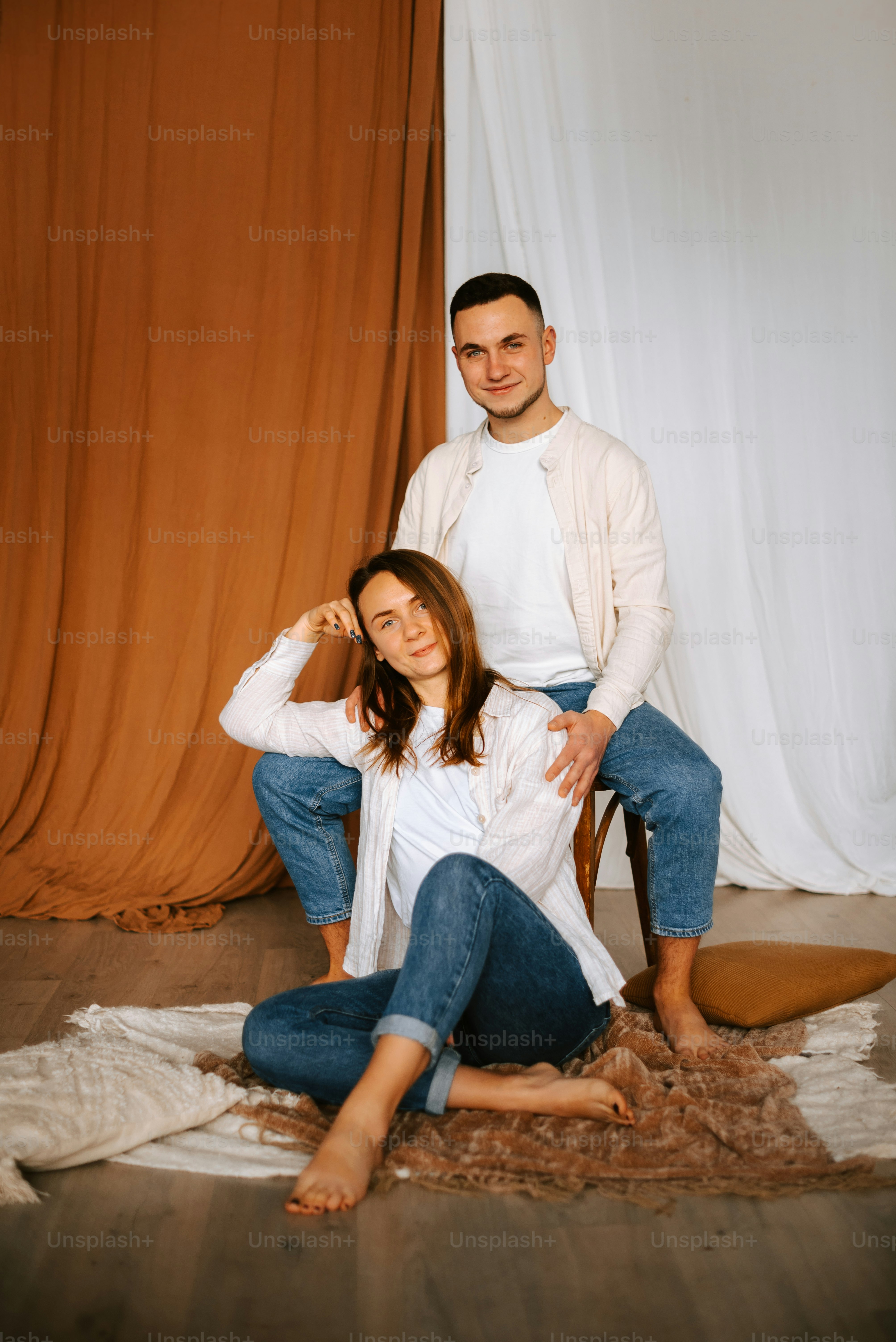 a man and a woman sitting on the floor