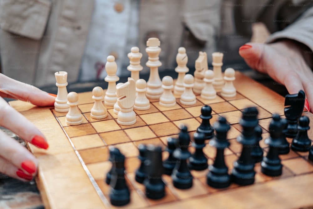 a close up of a person playing a game of chess