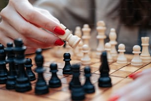 a woman is playing a game of chess
