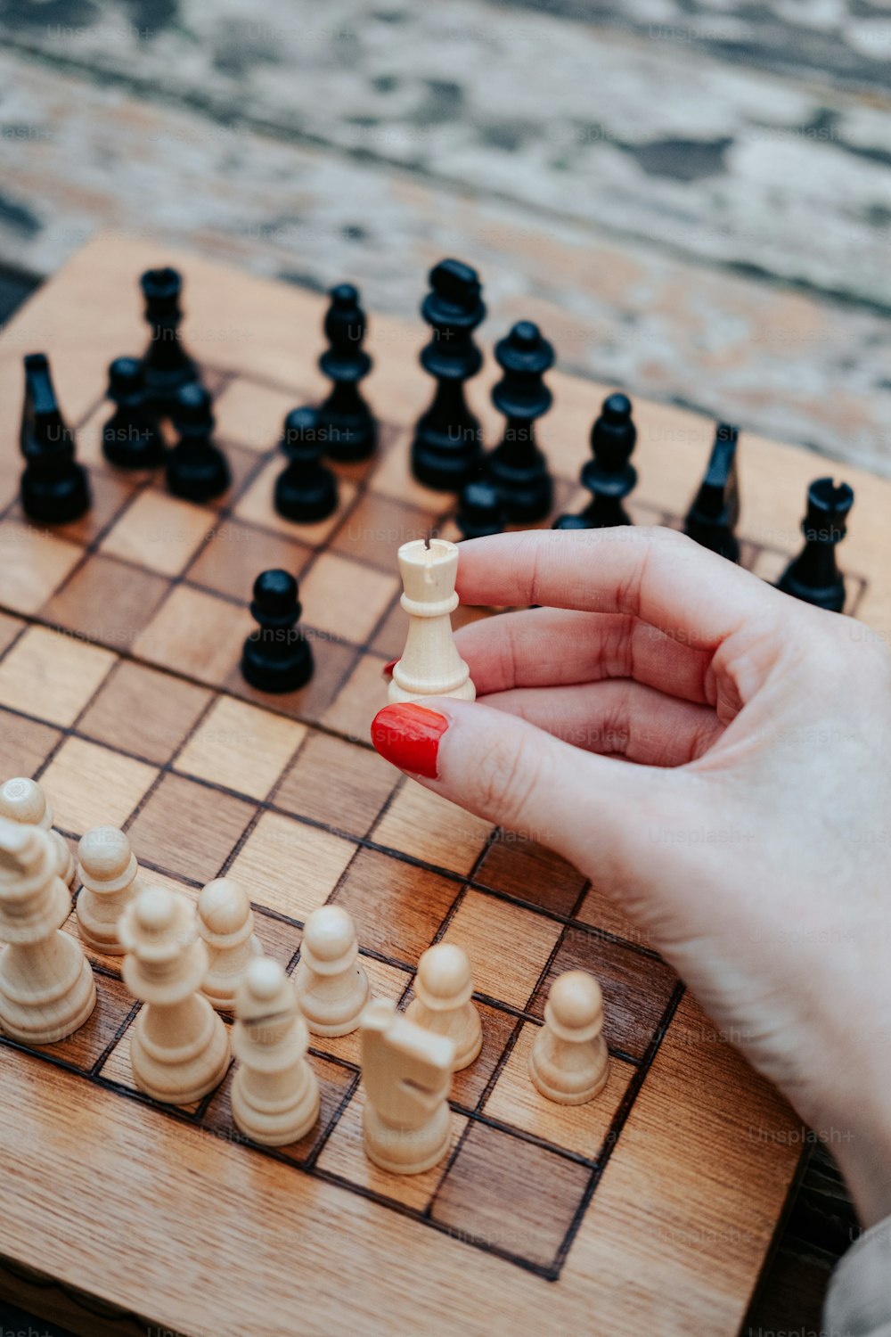 a person is playing a game of chess