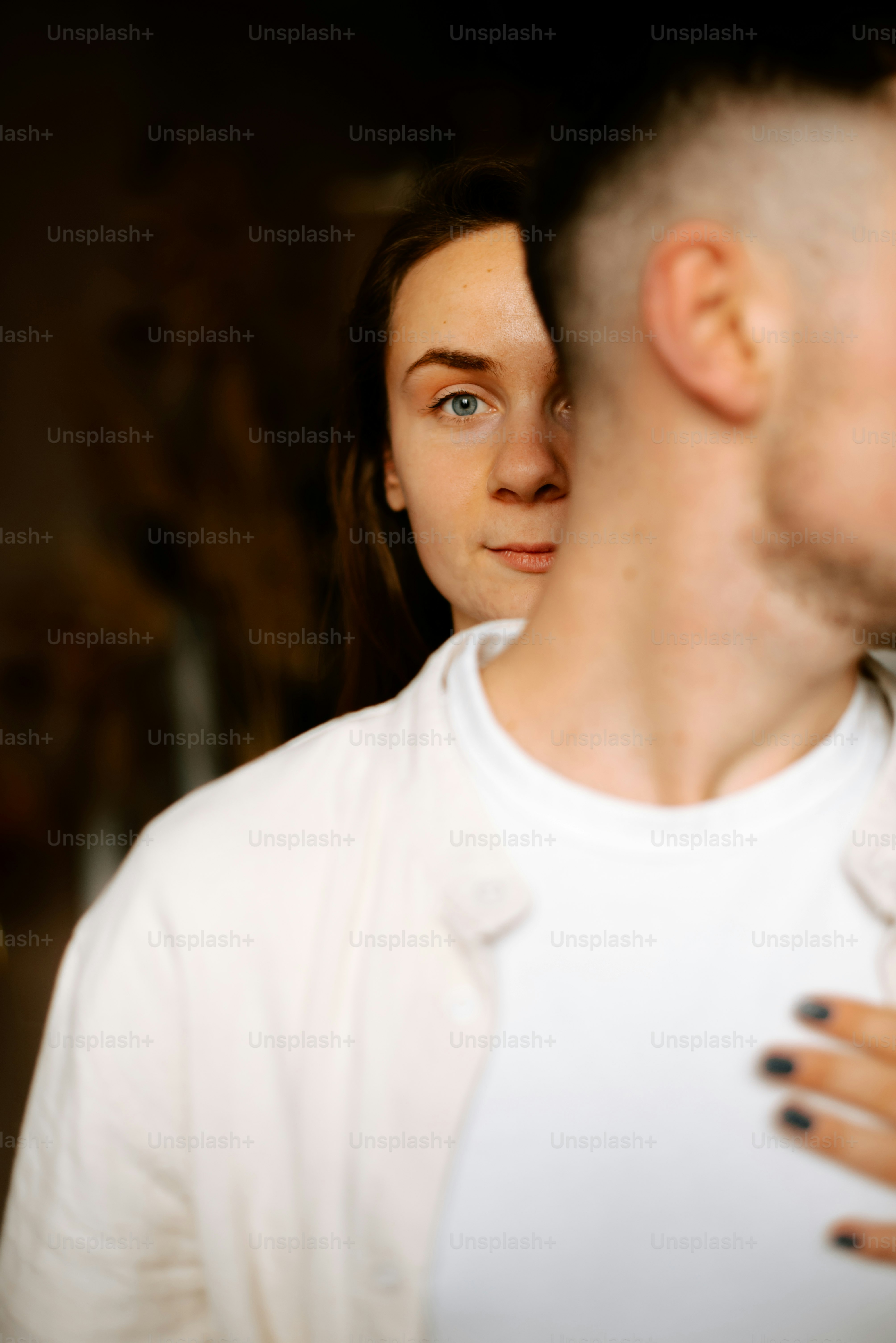 A man and a woman standing next to each other photo – Couple Image on ...