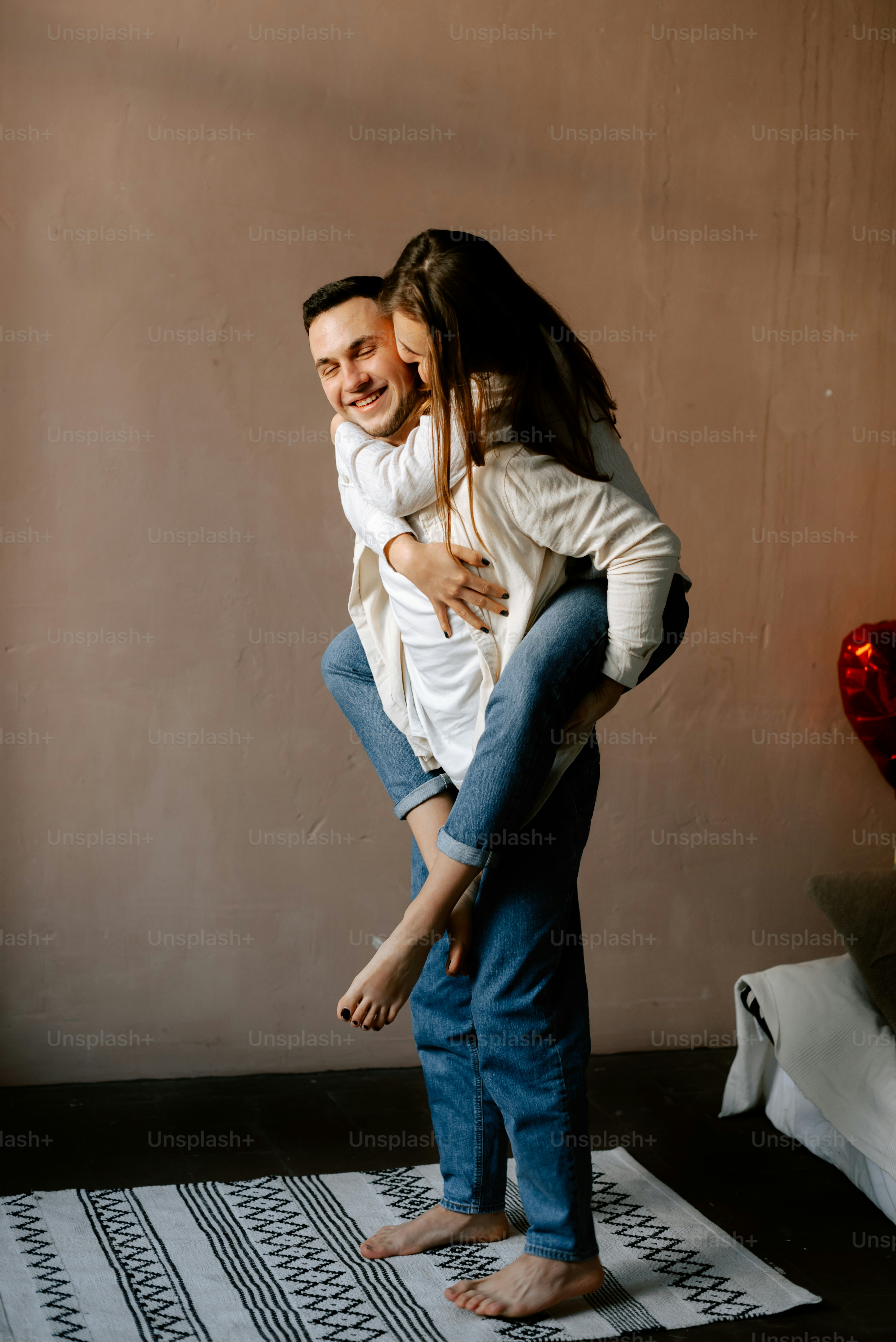 a man carrying a woman on his back