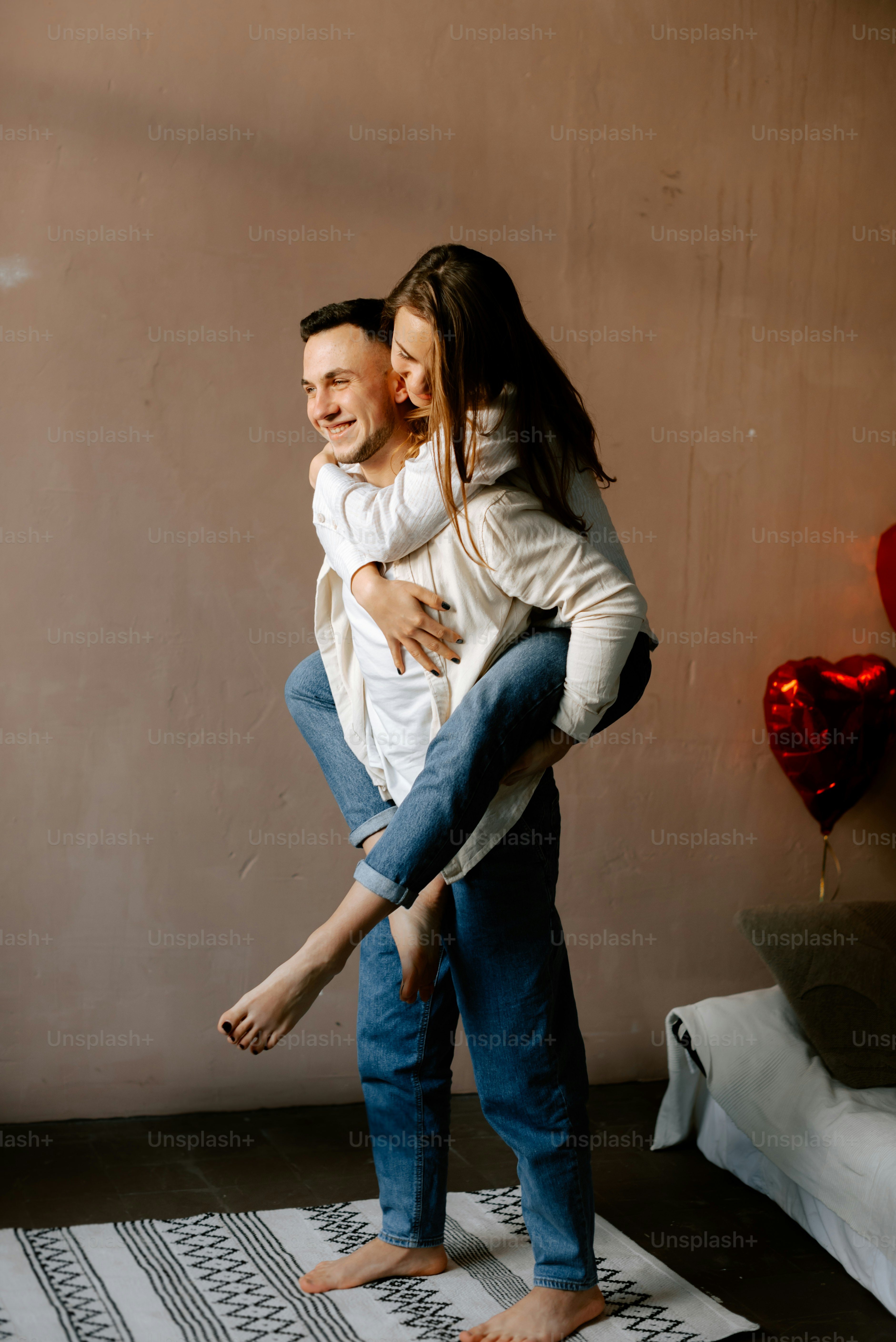 a man carrying a woman on his back