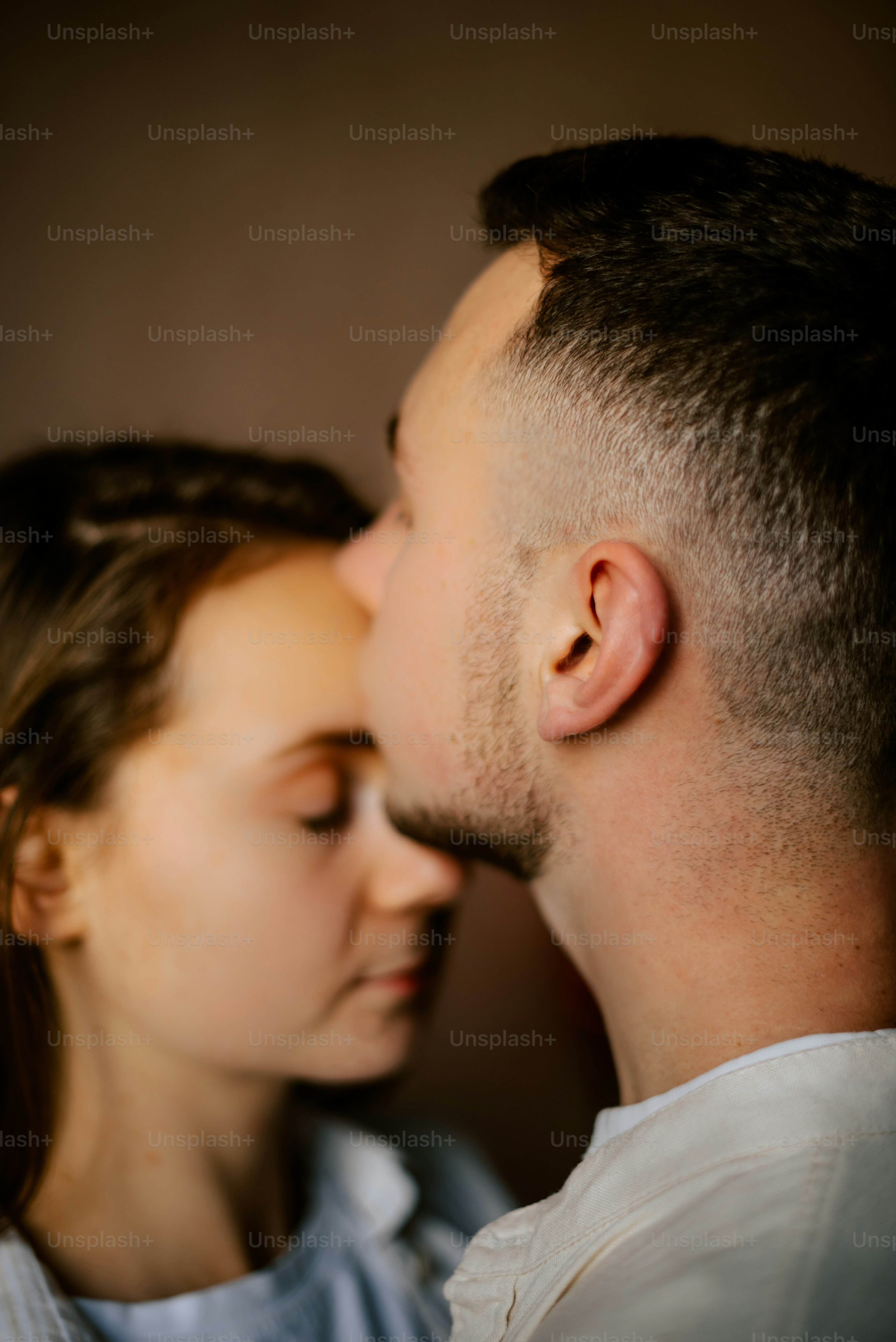 a close up of a person kissing a person
