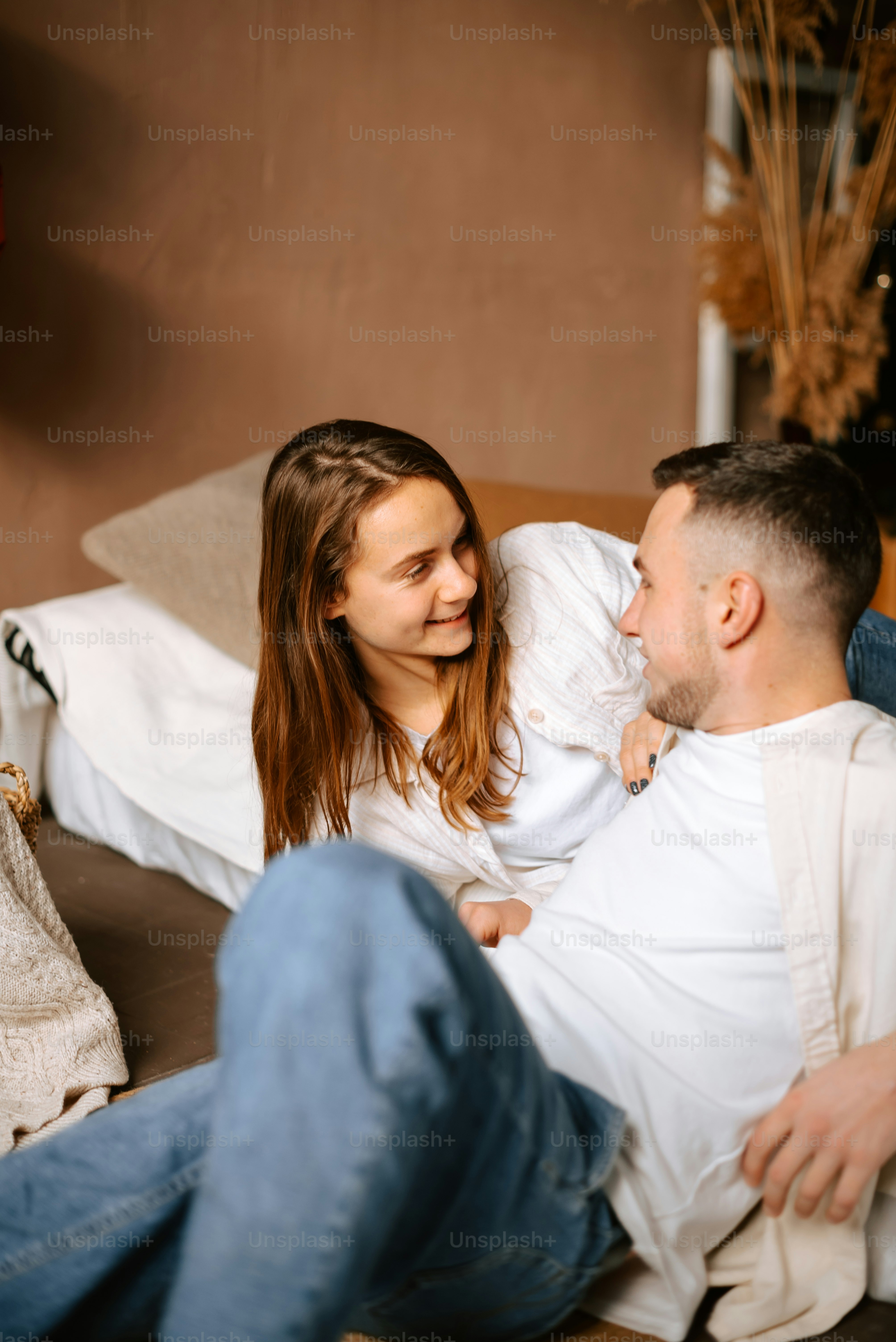 a man and a woman sitting on a couch