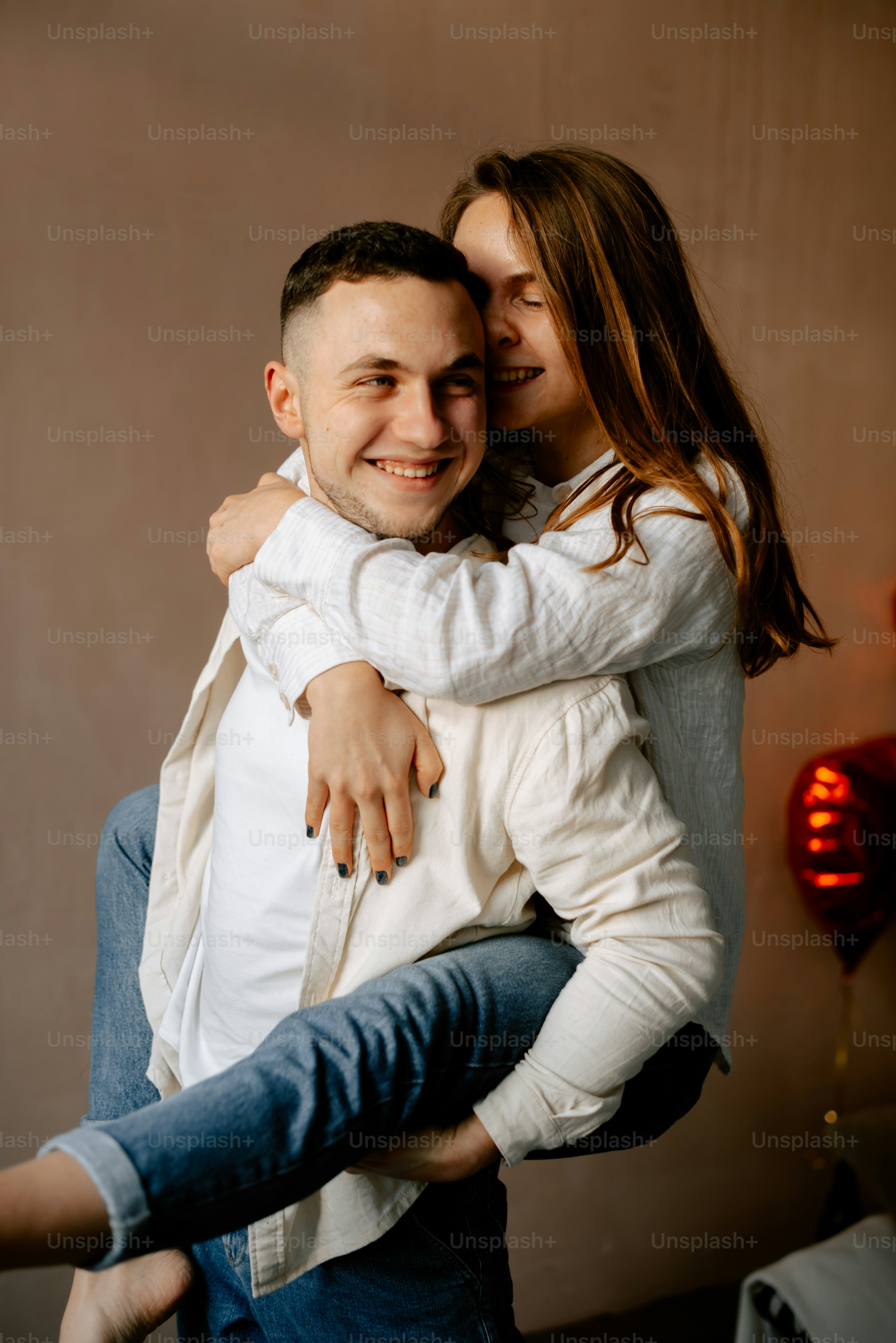 a man holding a woman in his arms