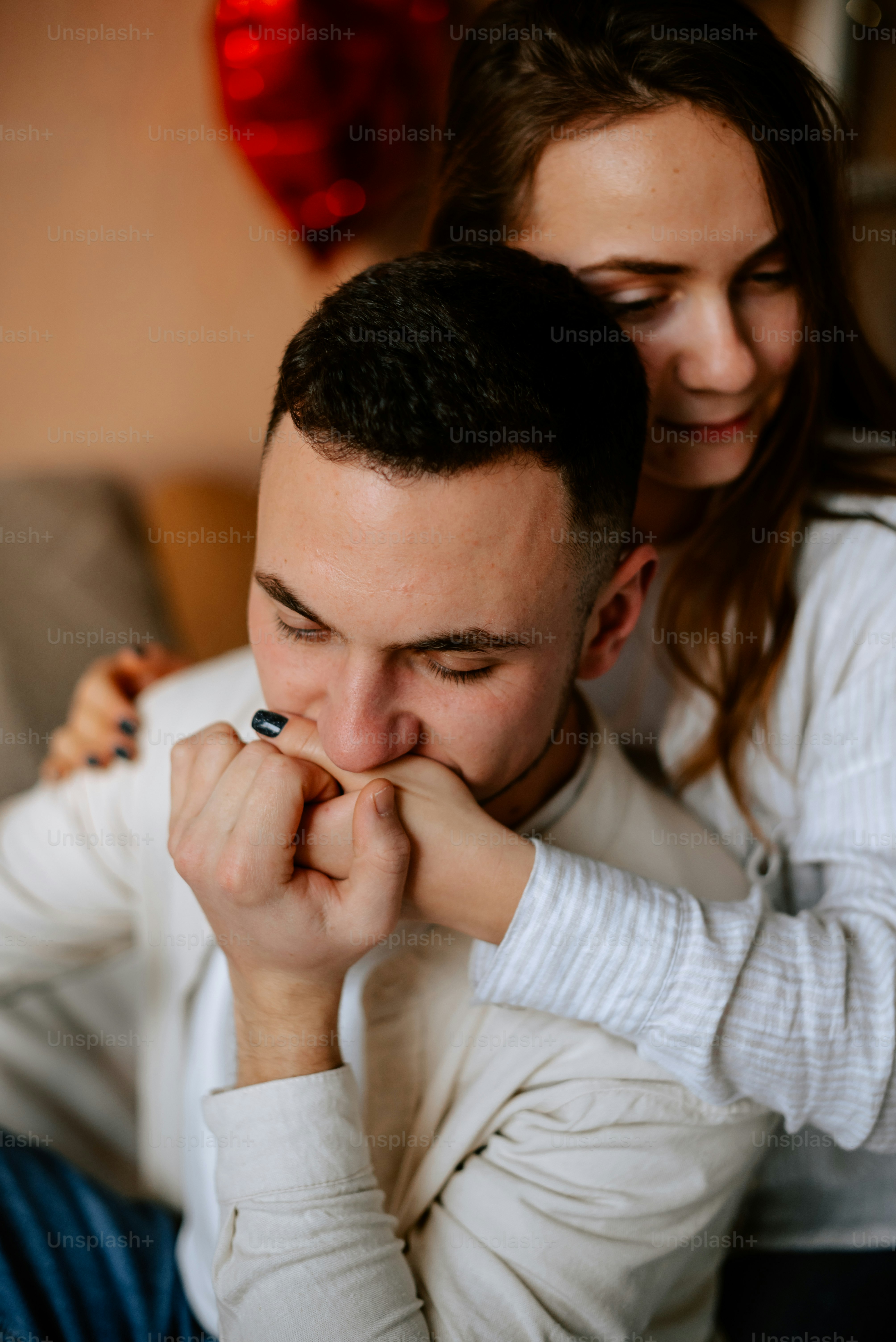 a man and a woman sitting on a couch