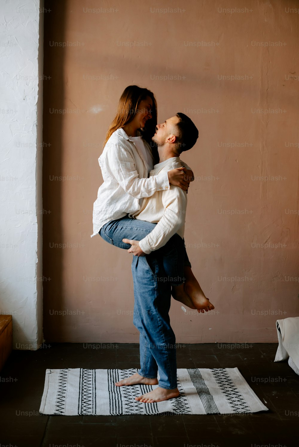 a man holding a woman on his back