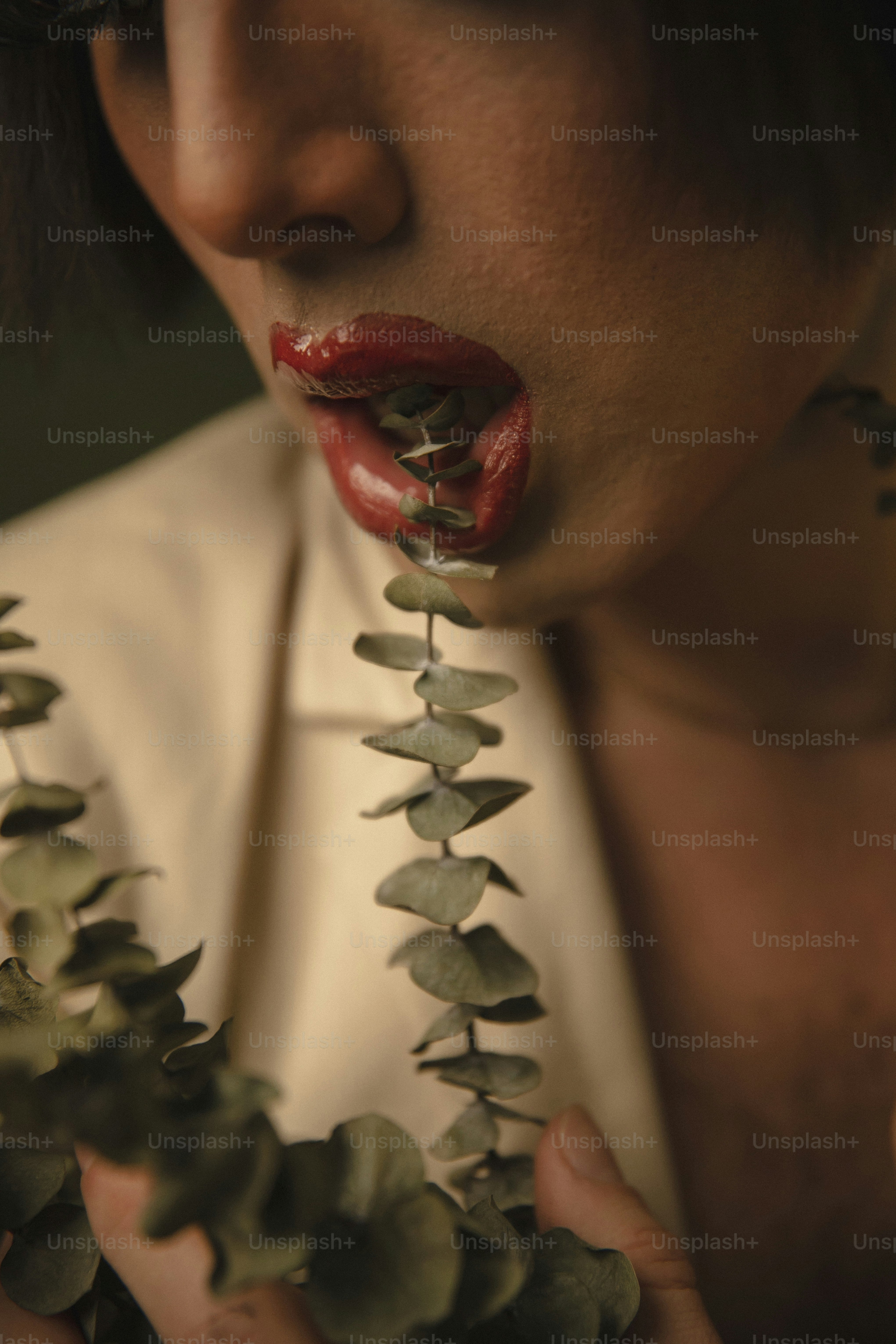 a close up of a person holding a plant