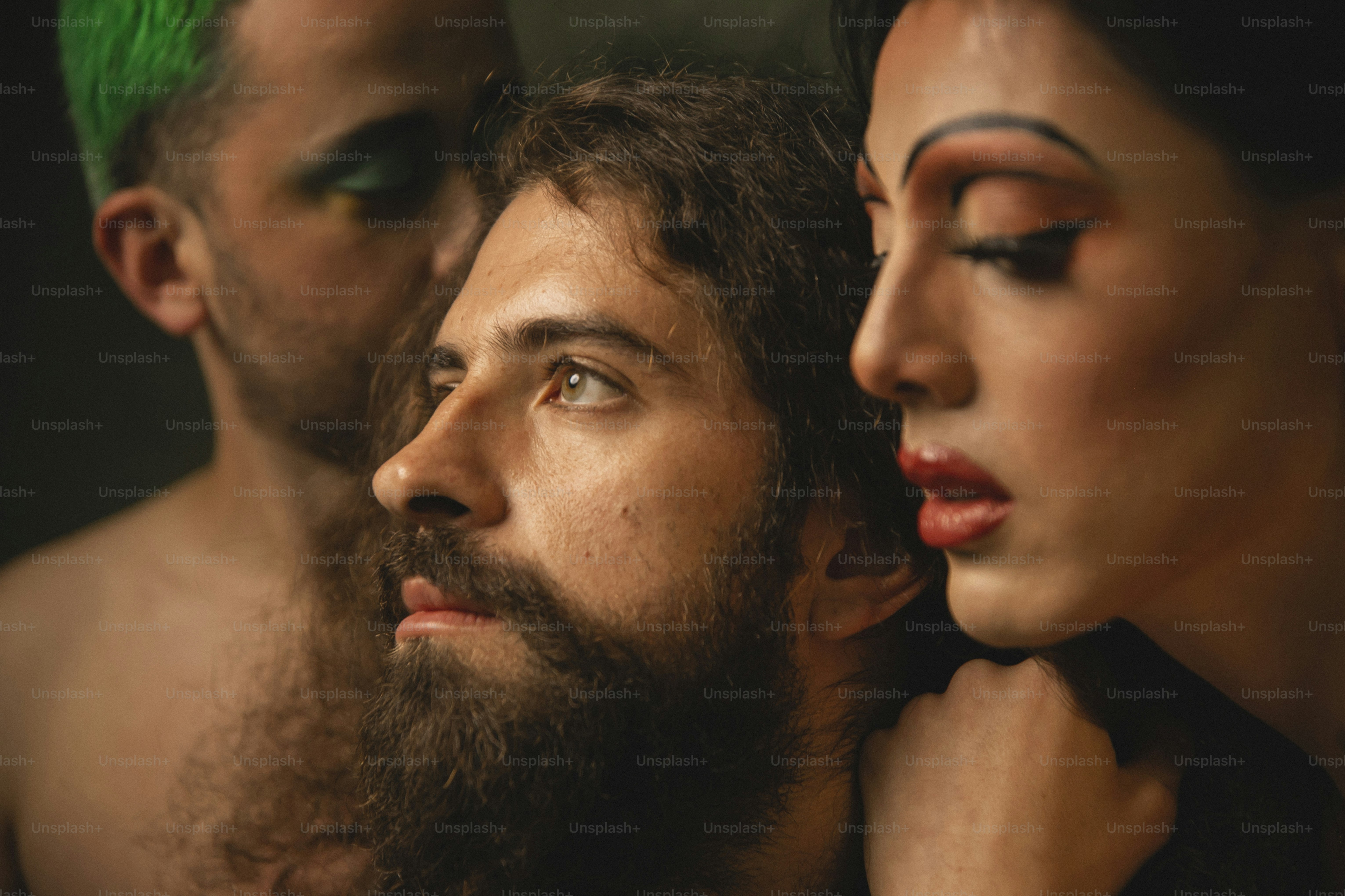 a man and a woman with green hair and makeup