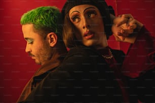 a man and a woman with green hair