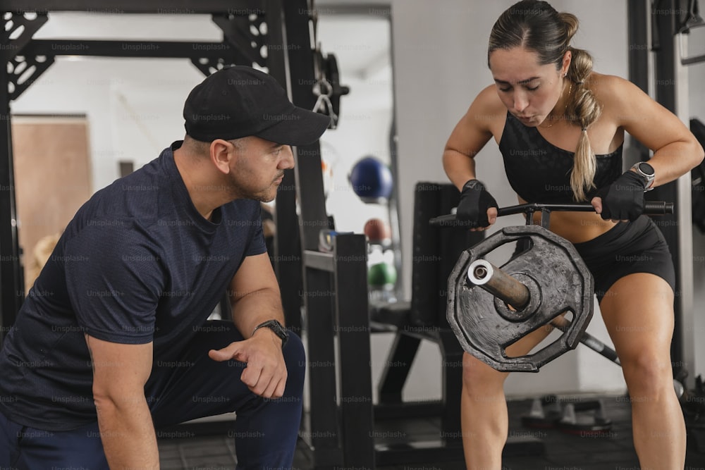 a man and a woman working out in a gym