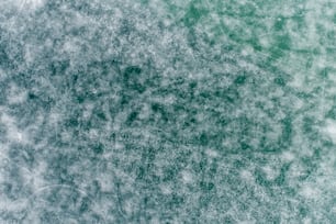 a green and white photo of some snow