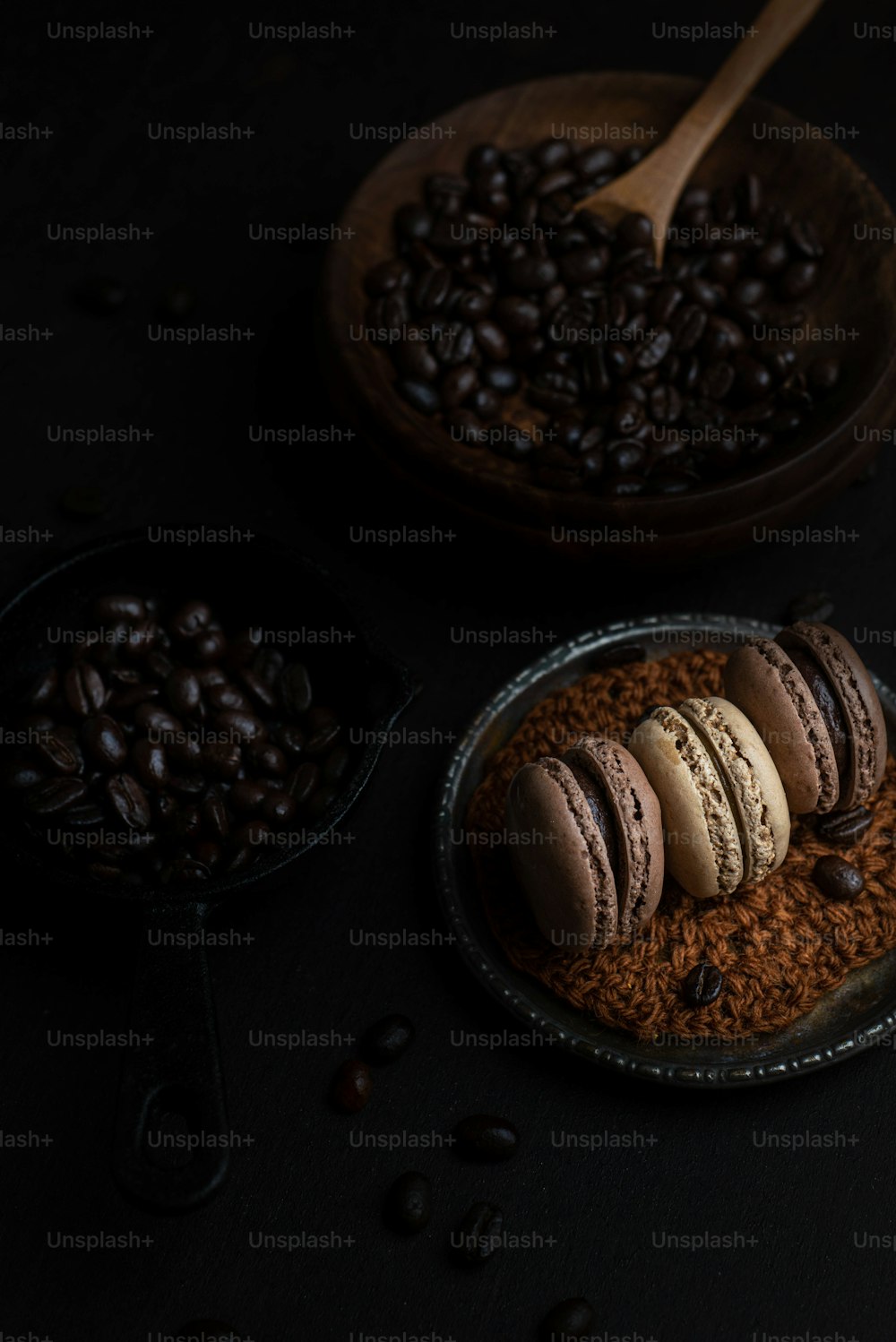 a plate of macaroons and coffee beans