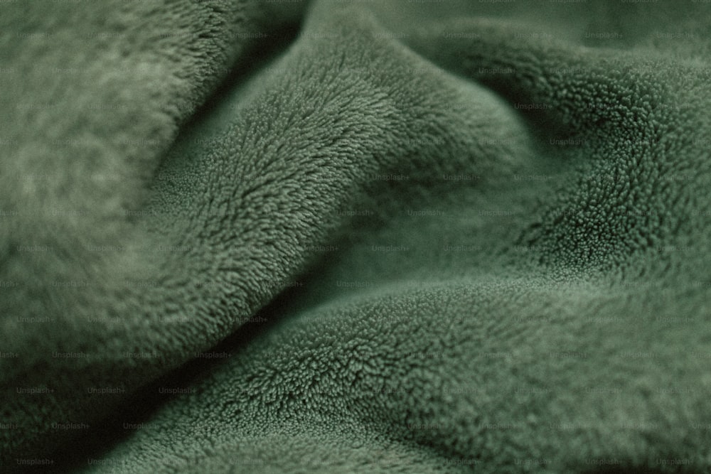 a close up view of a green blanket