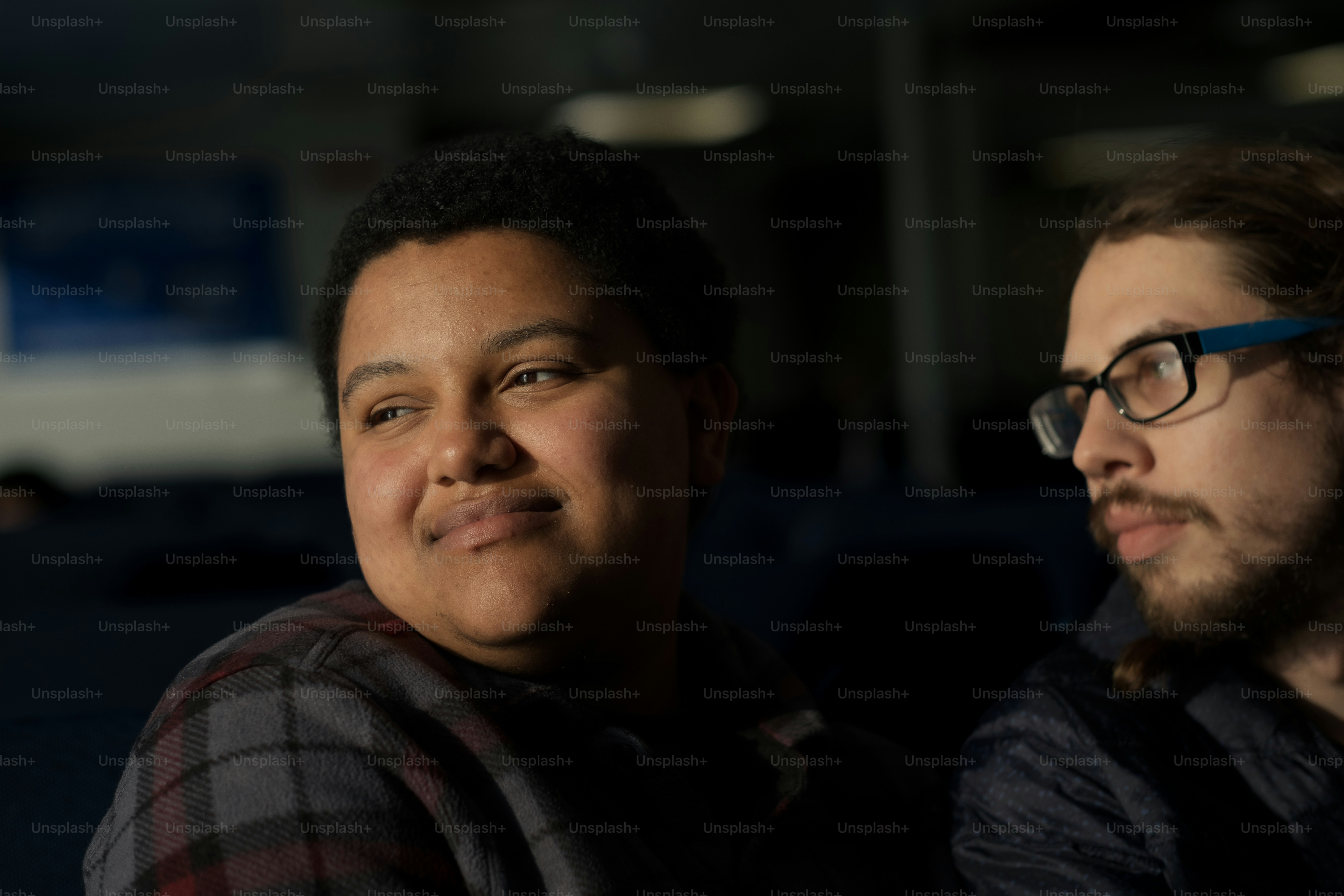 a man and a woman sitting next to each other