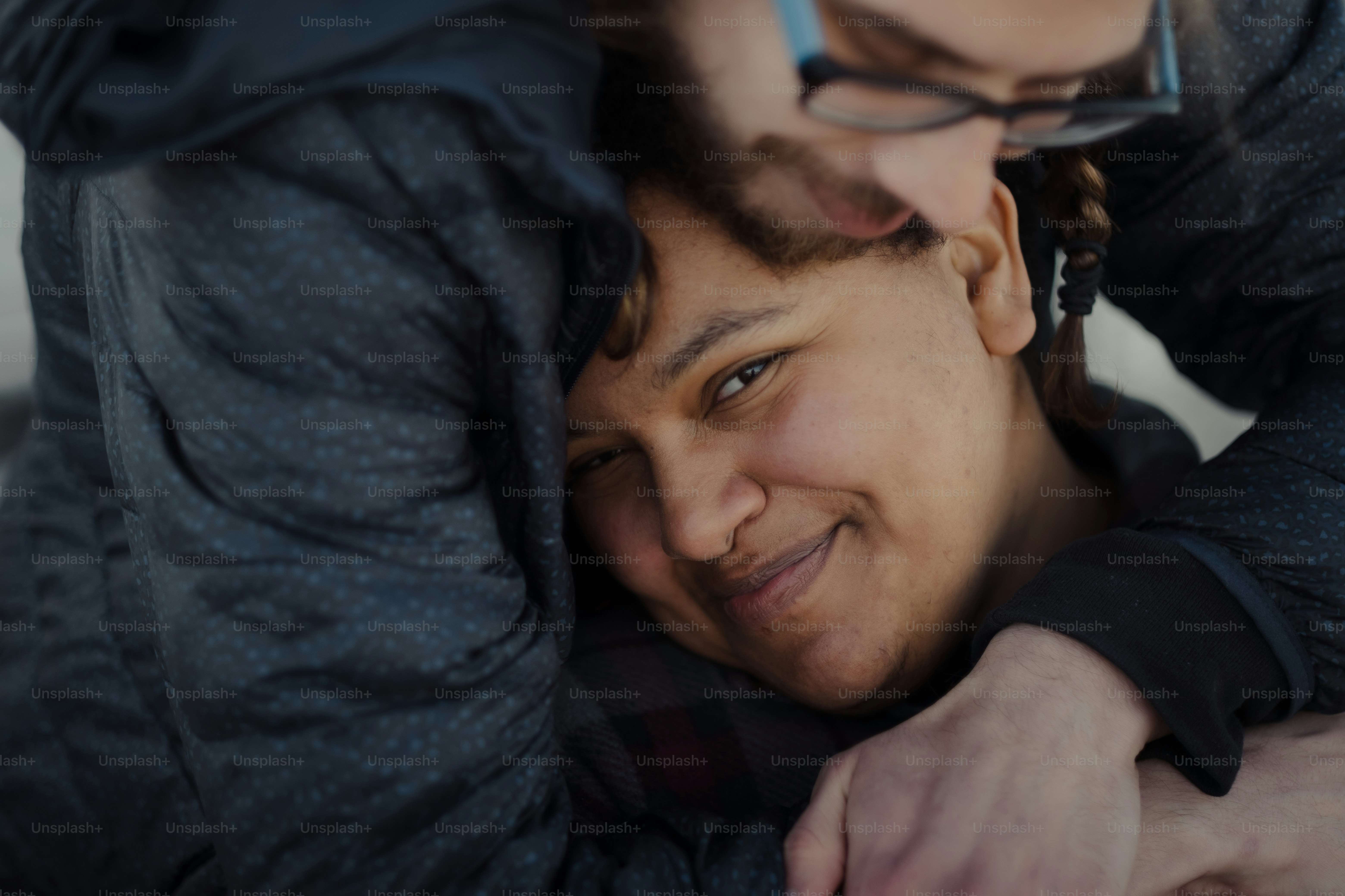 a couple of people that are hugging each other