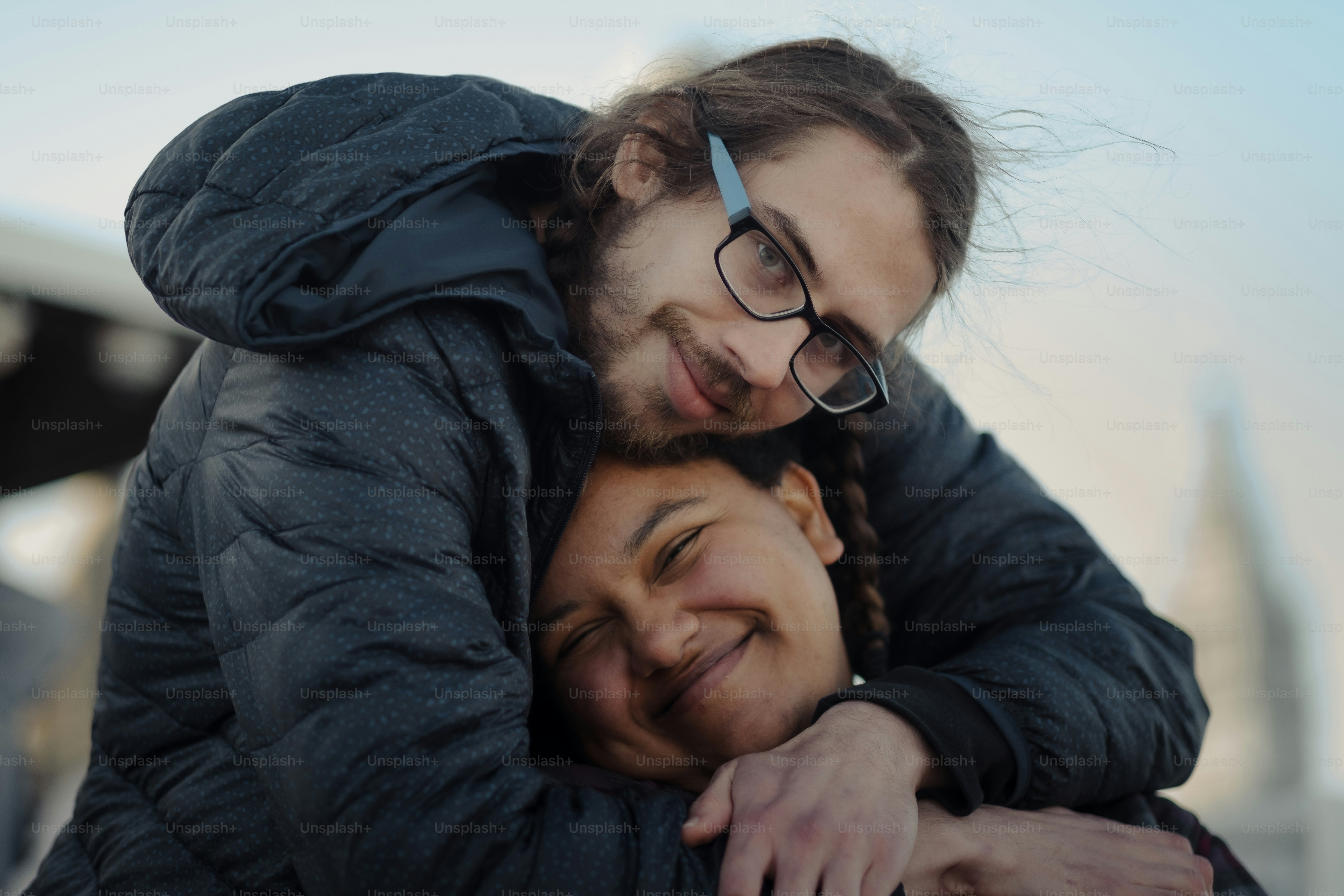 a man and a woman hugging each other